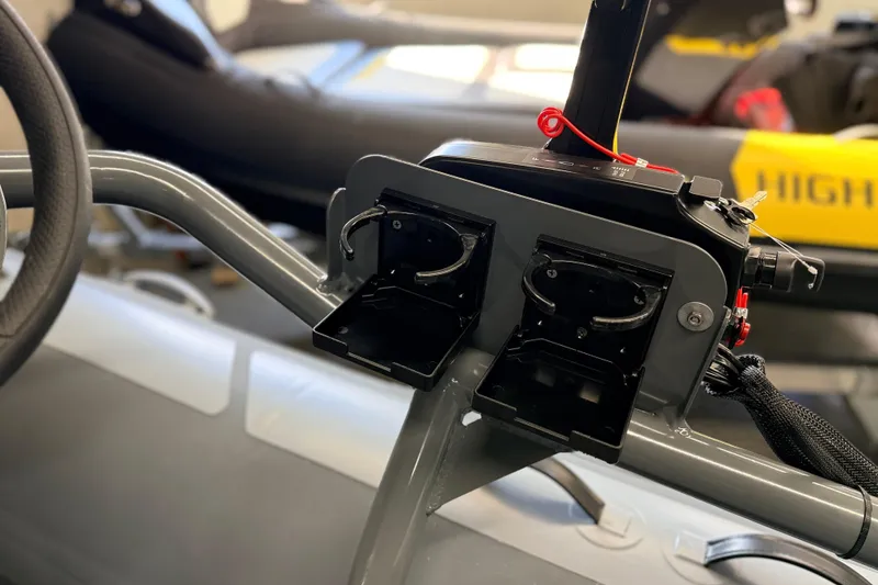 Slide: The Image of Control panel of 2026 Highfield Classic 400 boat, featuring dual cup holders. - 10