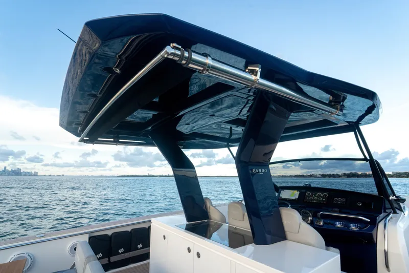 Slide: The Image of Helm of 2021 Pardo Yachts 43 with modern navigation equipment, overlooking serene waters. - 18