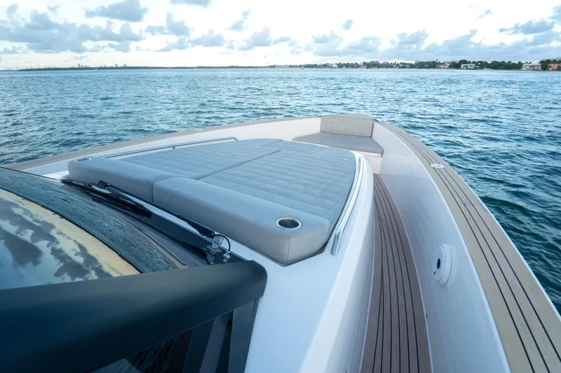 Slide: The Image of 2021 Pardo Yachts 43 on calm water, featuring sleek deck design and luxurious seating. - 26