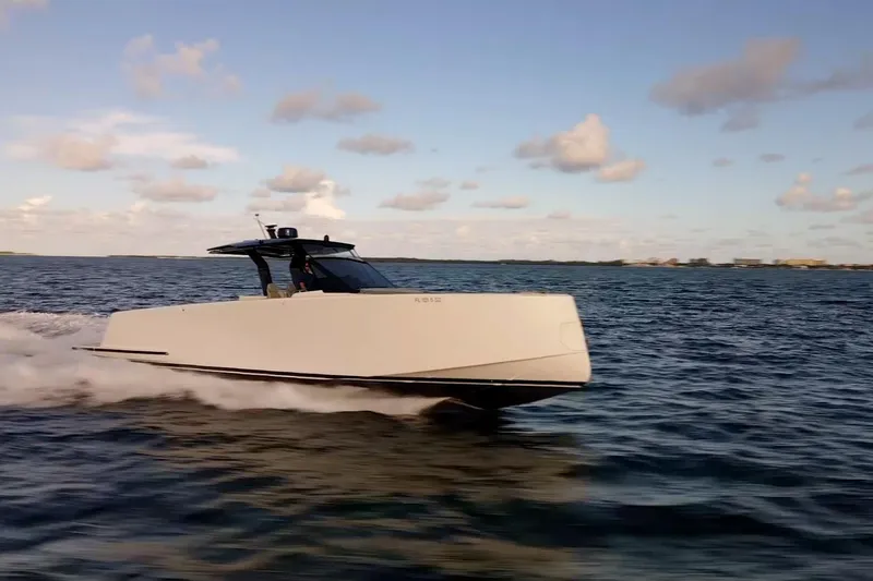 Slide: The Image of 2021 Pardo Yachts 43 cruising on open water, creating a dynamic wake. - 4