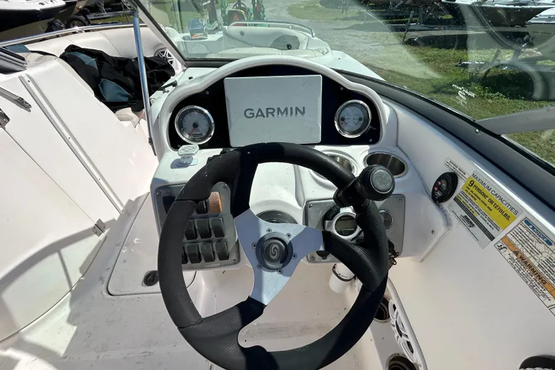 Slide: The Image of 2011 Hurricane SunDeck 2000 OB boat dashboard with Garmin navigation system. - 11