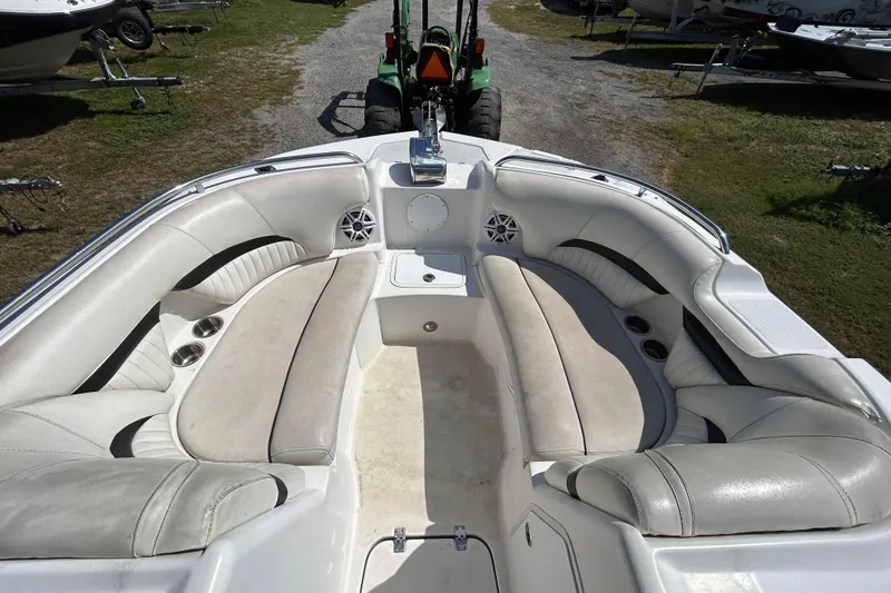 Slide: The Image of 2011 Hurricane SunDeck 2000 OB boat interior with spacious seating and cup holders. - 5