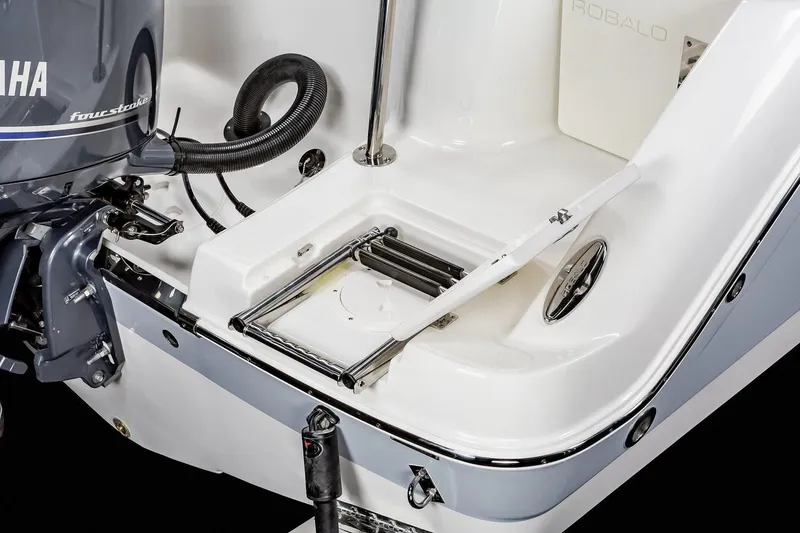 Slide: The Image of Manufacturer Provided Image: 2025 Robalo R222 Explorer boat interior with seating and table. - 13