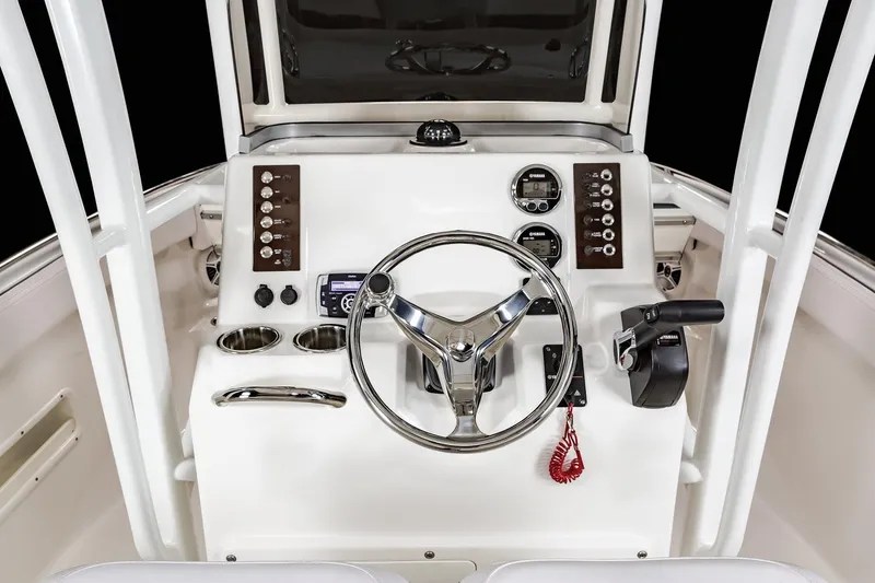 Slide: The Image of Manufacturer Provided Image: 2025 Robalo R222 Explorer boat cruising on a calm lake with passengers onboard. - 8