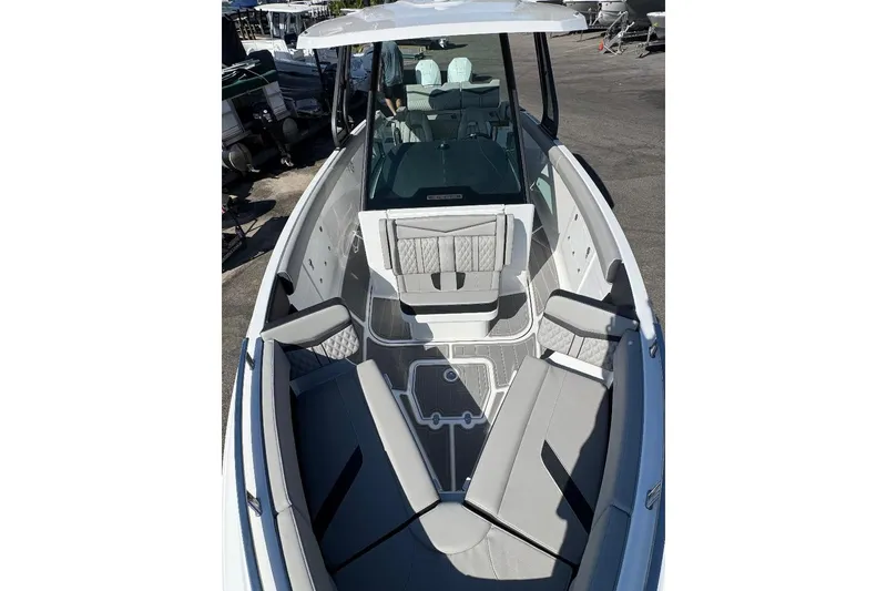 Slide: The Image of 2026 Monterey Elite 30 OB boat with spacious seating and modern design. - 10