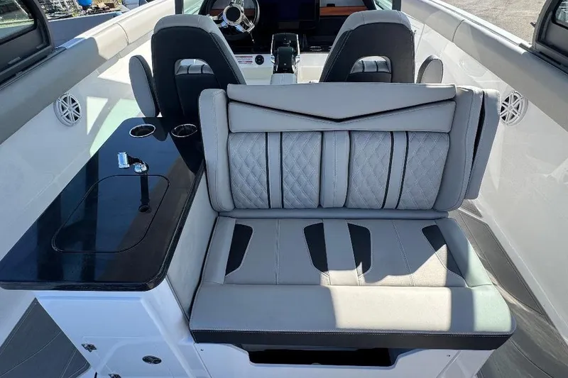 Slide: The Image of Luxurious interior of 2026 Monterey Elite 30 OB boat with plush seating and sleek design. - 4