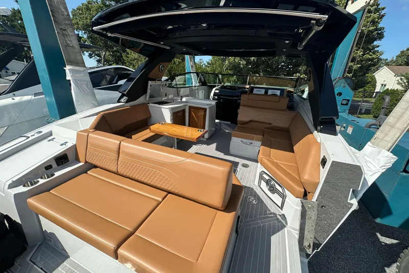 Slide: The Image of 2026 Cruisers Yachts 38 GLS OB interior with tan seating and modern design. - 4