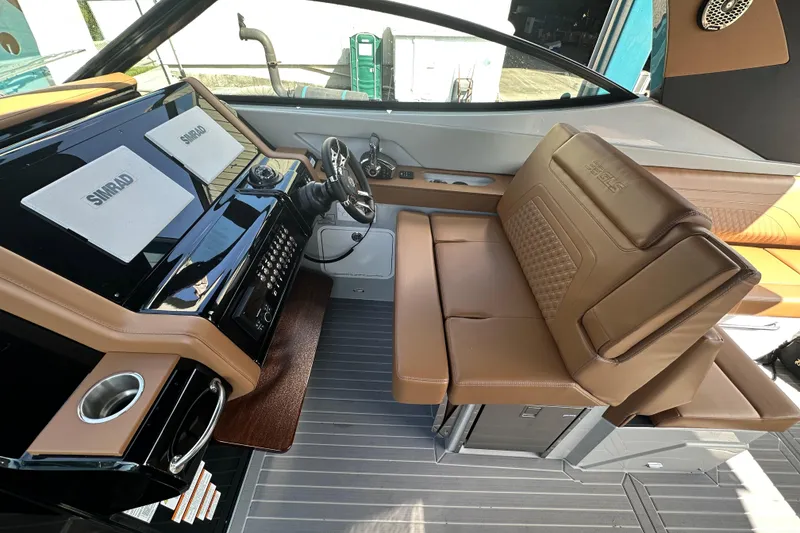 Slide: The Image of Luxurious interior of 2026 Cruisers Yachts 38 GLS OB with leather seating and advanced controls. - 9