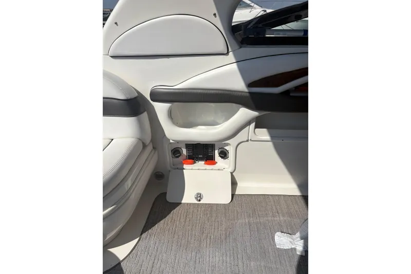 Slide: The Image of 2005 Sea Ray 290 Sun Sport interior detail with seating and control panel. - 13