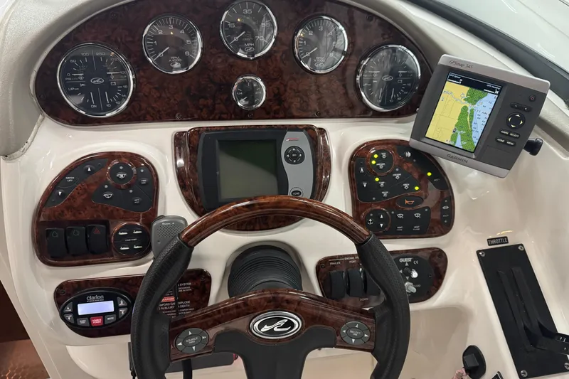 Slide: The Image of Dashboard of a 2005 Sea Ray 290 Sun Sport boat with navigation instruments. - 14