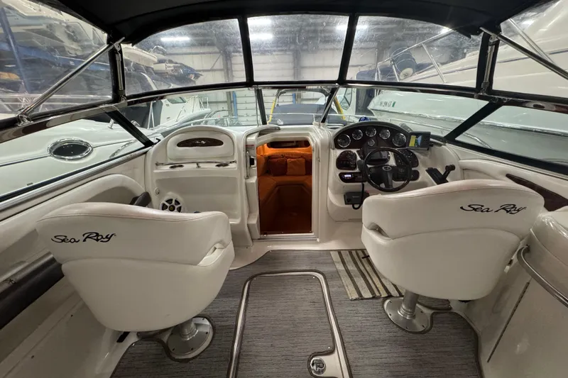 Slide: The Image of Interior view of 2005 Sea Ray 290 Sun Sport boat with helm and seating. - 17