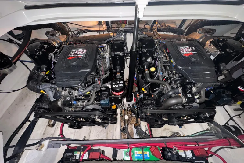 Slide: The Image of Twin engines of a 2005 Sea Ray 290 Sun Sport boat, showcasing 350 MAG MPI motors. - 20