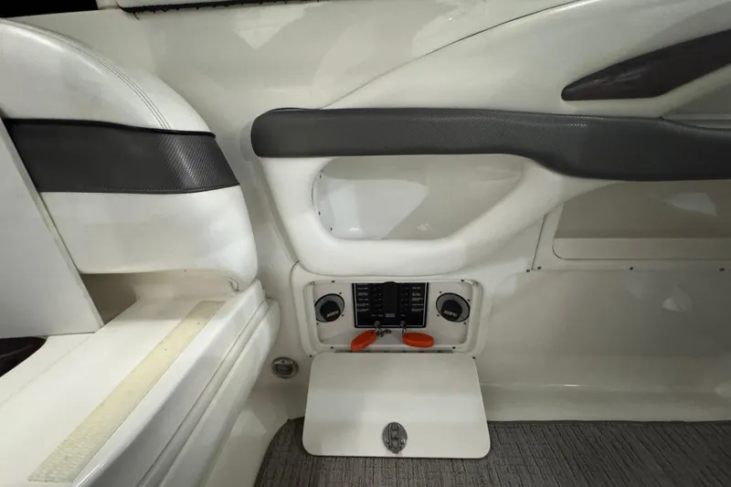 Slide: The Image of 2005 Sea Ray 290 Sun Sport interior control panel with white and black accents. - 27