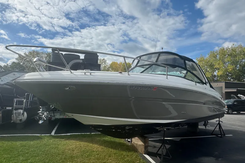 Slide: The Image of 2005 Sea Ray 290 Sun Sport boat on display under a partly cloudy sky. - 4