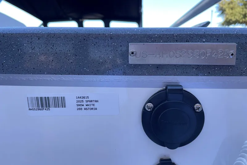 Slide: The Image of 2025 Spartan 200 Astoria boat identification plate and connector port. - 12