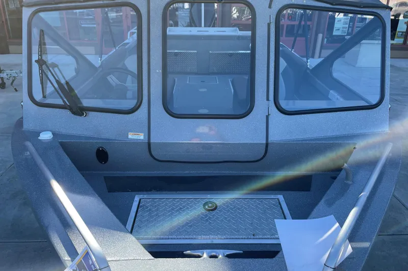 Slide: The Image of 2025 Spartan 200 Astoria boat with windshield and deck view. - 4