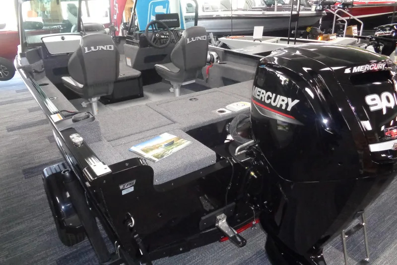 Slide: The Image of 2025 Lund 1675 Adventure Sport boat with Mercury 90 HP engine in showroom. - 2