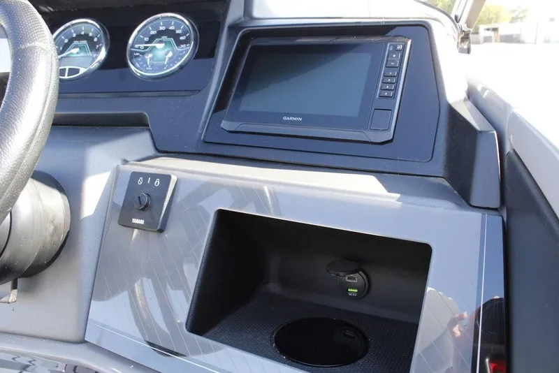 Slide: The Image of Dashboard of 2026 Avalon Catalina Cruise Rear Bench 25 FT with Garmin display and controls. - 25