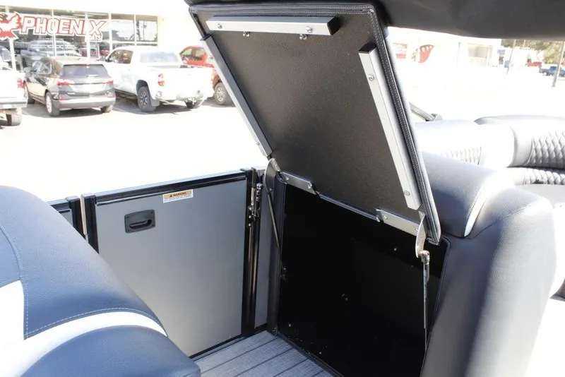 Slide: The Image of 2026 Avalon Catalina Cruise Rear Bench storage compartment open, showcasing interior space. - 29