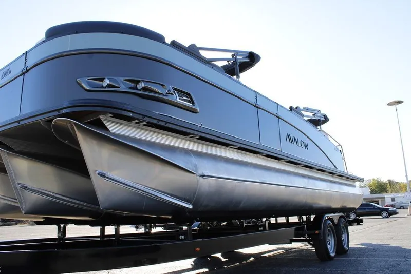Slide: The Image of 2026 Avalon Catalina Cruise Rear Bench 25 FT pontoon boat on trailer, side view. - 5