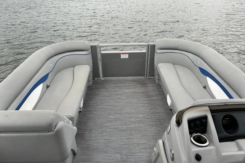 Slide: The Image of 2022 Bennington 22 SS pontoon boat interior with gray seating and water view. - 10