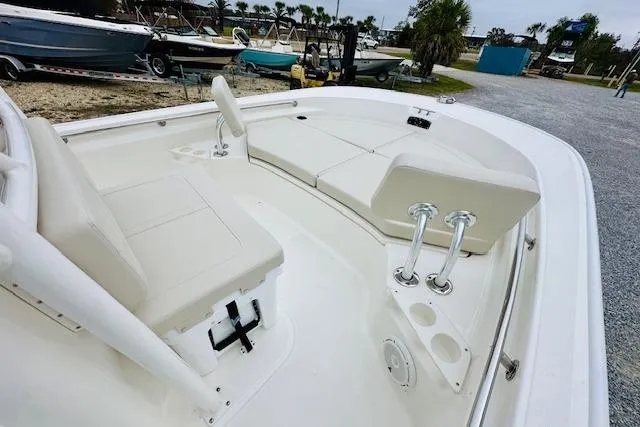 Slide: The Image of 2026 Boston Whaler 210 Montauk boat interior with white seating and cup holders. - 17