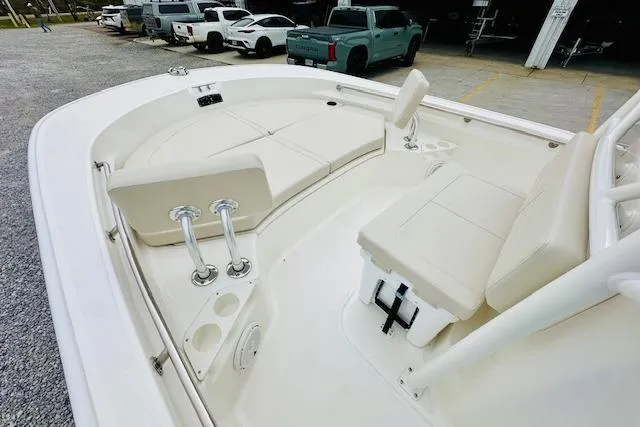 Slide: The Image of 2026 Boston Whaler 210 Montauk boat interior with seating and rod holders. - 18