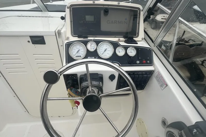 Slide: The Image of Steering console of a 2000 Boston Whaler 21 Conquest with Garmin navigation system. - 9