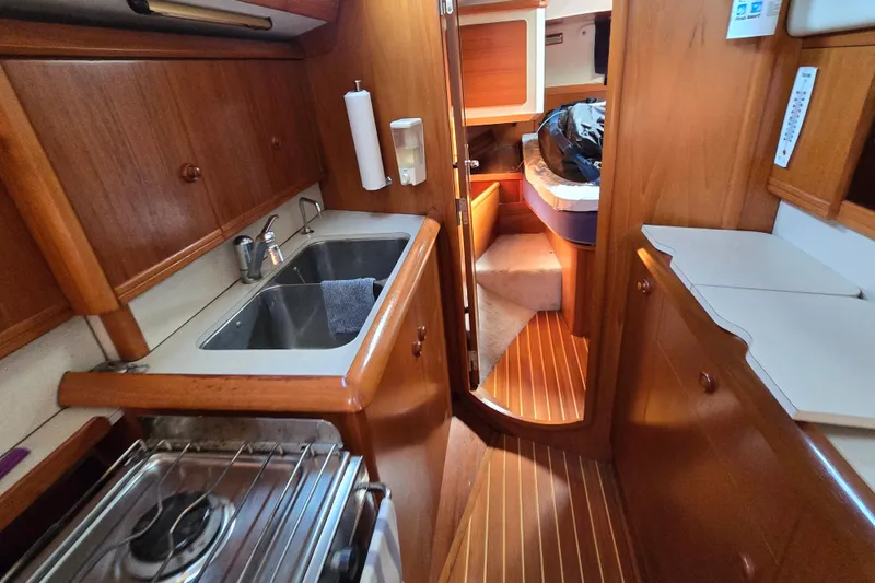 Slide: The Image of Jeanneau Sun Odyssey 42 cockpit with Raymarine and Autopilot systems. - 12