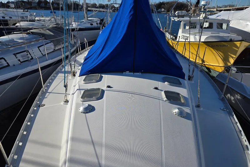 Slide: The Image of Jeanneau Sun Odyssey 42 Center Cockpit, 1998 model, docked at marina. - 15