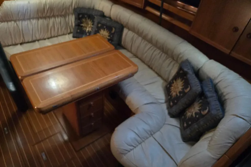 Slide: The Image of Interior of 1998 Jeanneau Sun Odyssey 42 with cozy seating area. - 24