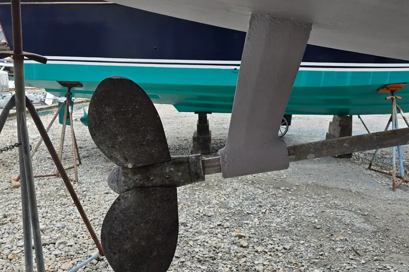 Slide: The Image of Propeller and rudder of 1998 Jeanneau Sun Odyssey 42 CC sailboat on dry dock. - 36