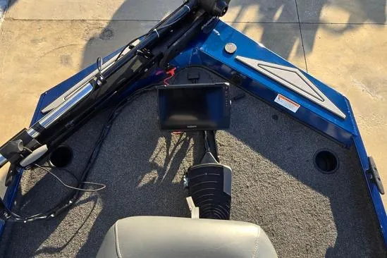 Slide: The Image of 2022 Lowe Skorpion 16 boat interior with navigation equipment and seating. - 3