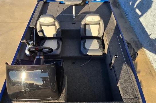 Slide: The Image of 2022 Lowe Skorpion 16 boat interior with dual seats and steering console. - 5