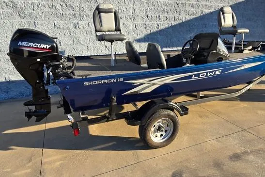 Slide: The Image of 2022 Lowe Skorpion 16 boat with Mercury engine, parked on concrete surface. - 9