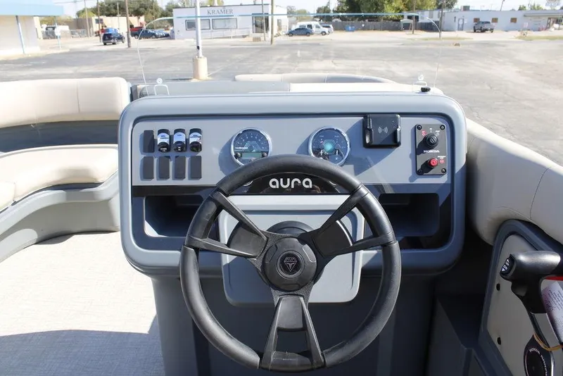 Slide: The Image of Steering console of 2026 Avalon AURA QUAD LOUNGER boat with modern controls. - 13