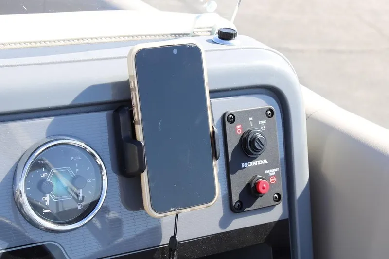 Slide: The Image of Control panel of 2026 Avalon AURA QUAD LOUNGER with smartphone holder and Honda ignition. - 20