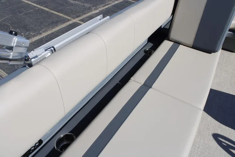 Slide: The Image of 2026 Avalon AURA QUAD LOUNGER boat seating with cup holders and sleek design. - 27