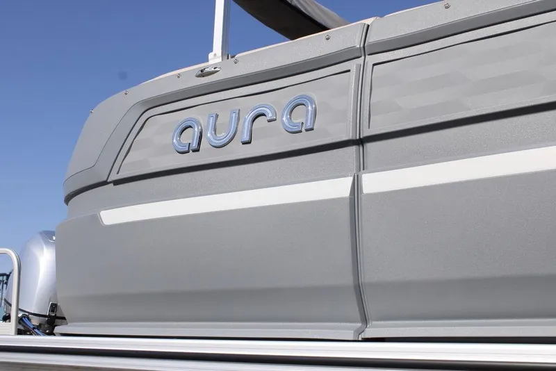 Slide: The Image of 2026 Avalon AURA QUAD LOUNGER boat, sleek gray design with "aura" logo. - 3