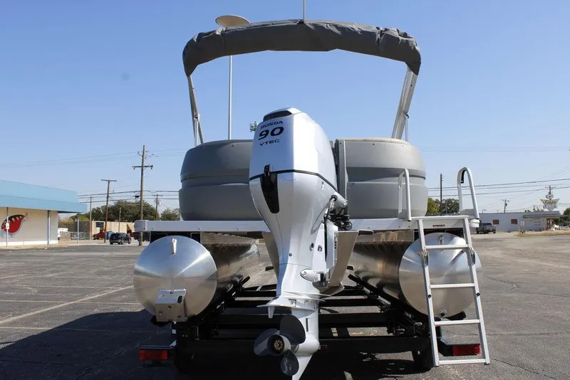 Slide: The Image of 2026 Avalon AURA QUAD LOUNGER pontoon boat with Honda 90 VTEC engine, rear view. - 8
