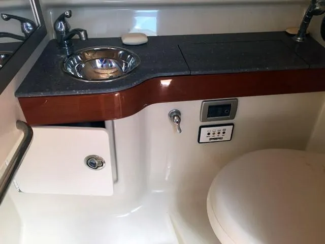 Slide: The Image of 2008 Formula 310 Sun Sport bathroom with sink, countertop, and toilet. - 11