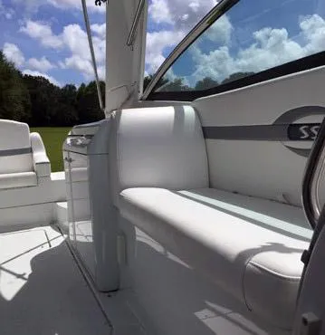 Slide: The Image of 2008 Formula 310 Sun Sport boat interior with white seating and sleek design. - 16