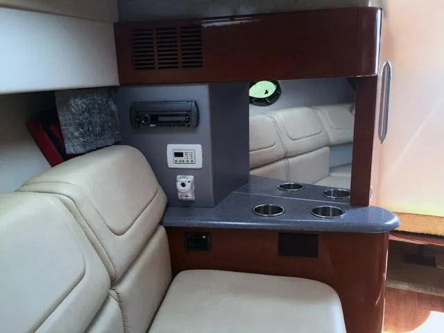 Slide: The Image of Interior of 2008 Formula 310 Sun Sport boat with beige seating and cup holders. - 5