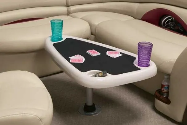 Slide: The Image of 2008 Sun Tracker Party Barge 25 I/O Regency Edition with seating and helm, docked outdoors. - 7