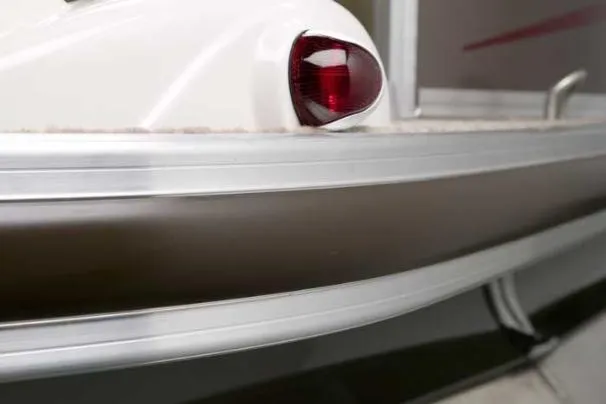 Slide: The Image of 2008 Sun Tracker Party Barge 25 I/O Regency Edition helm with steering wheel and gauges. - 9