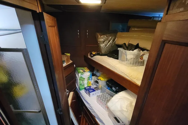 Slide: The Image of Interior of 1982 Hatteras 56 Wide Body yacht with storage and bunk bed. - 39