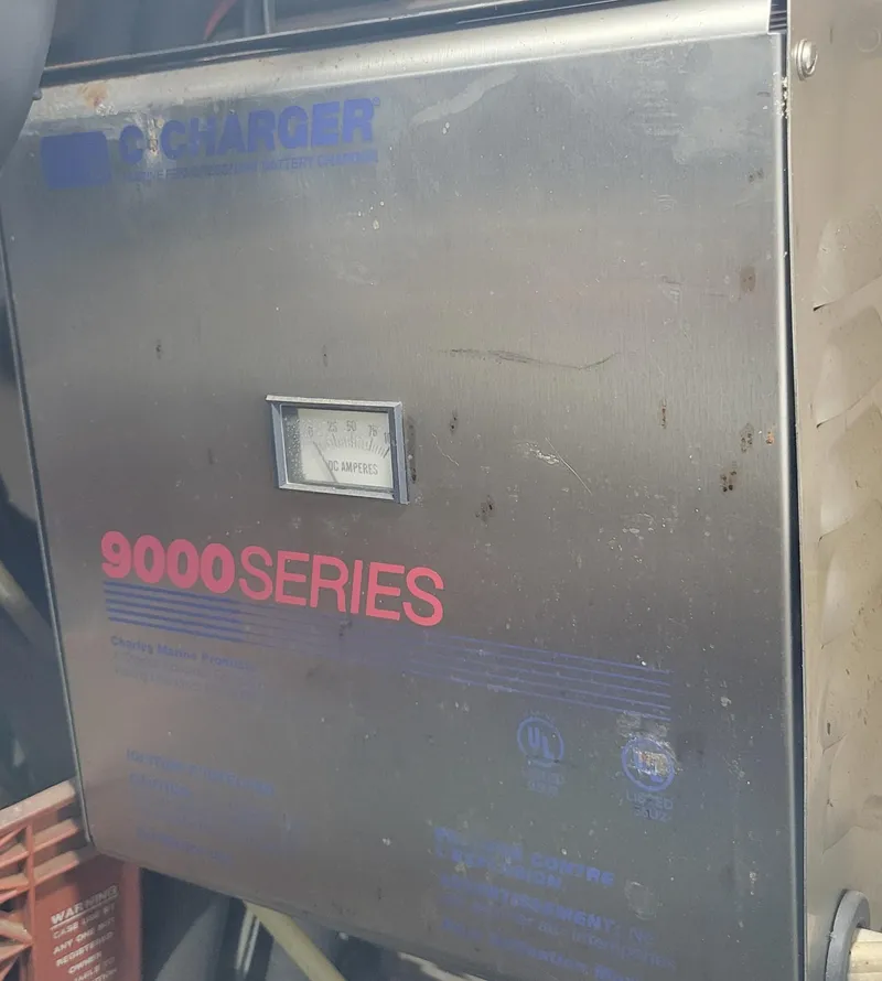 Slide: The Image of Battery charger labeled "9000 Series" on a 1982 Hatteras 56 Wide Body yacht. - 45