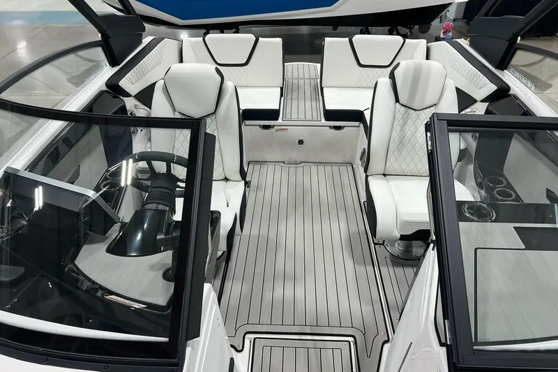 Slide: The Image of 2025 Yamaha Boats 222SE interior with white seating and sleek design. - 10