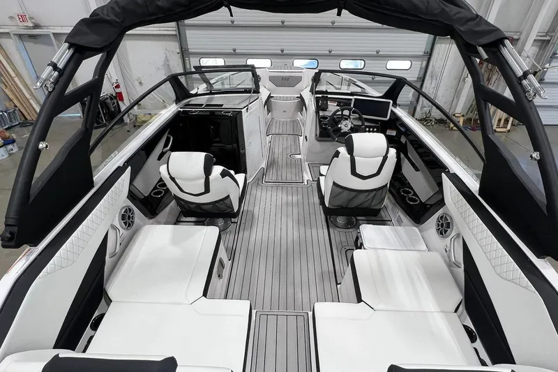 Slide: The Image of 2025 Yamaha Boats 222SE interior with sleek seating and modern dashboard design. - 5