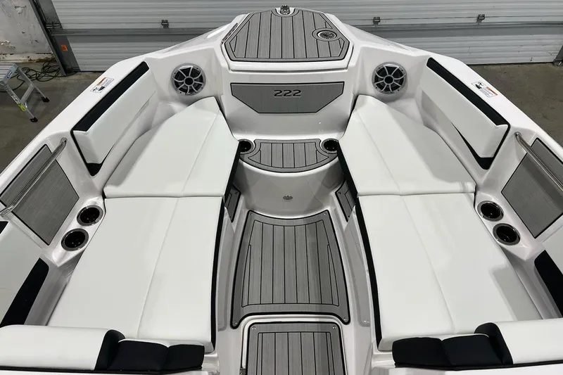 Slide: The Image of 2025 Yamaha Boats 222SE interior with white seating and modern design. - 6